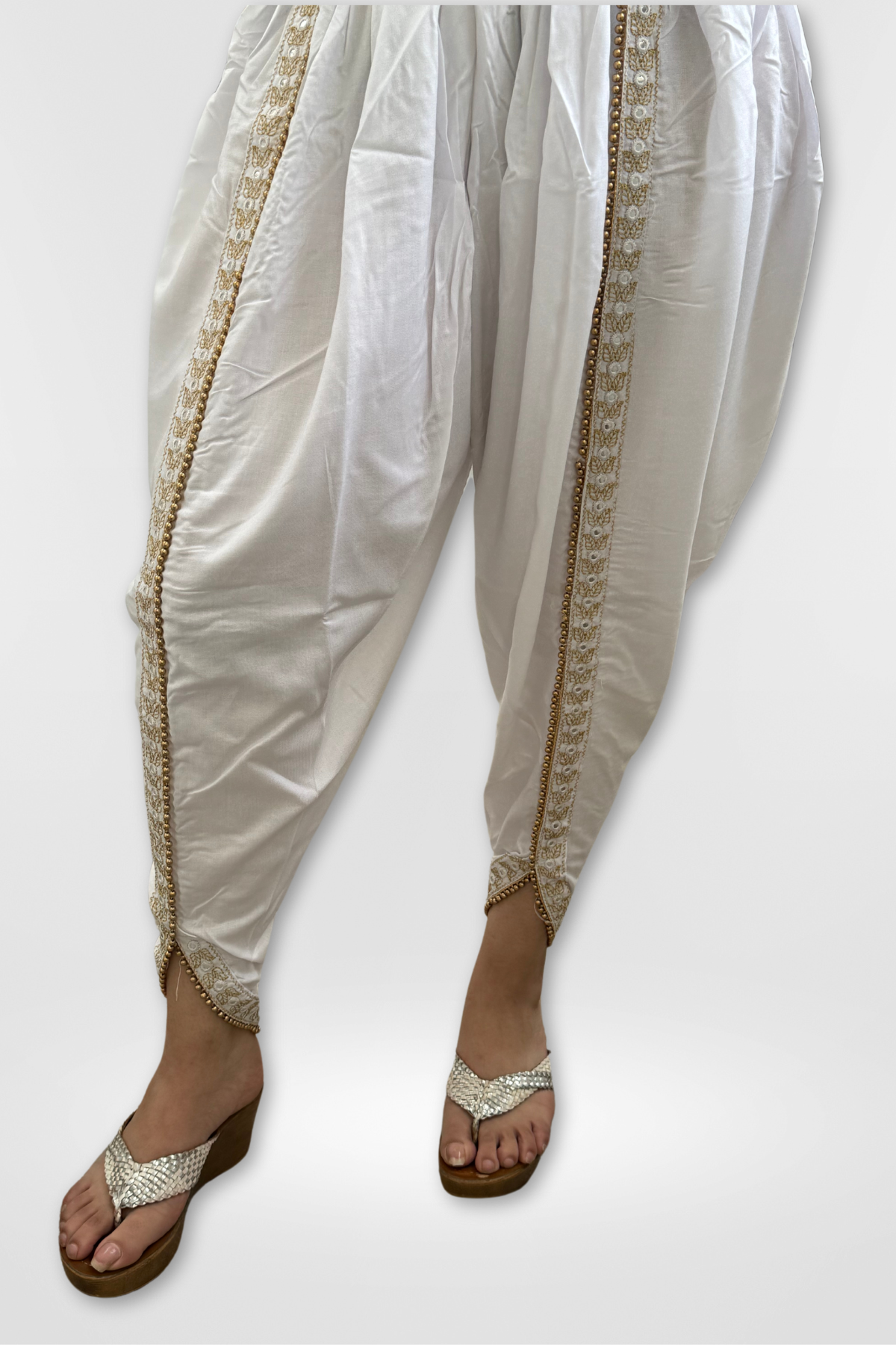 Our Rayon Dhoti Pants feature intricate embroidery and a Golden Pearl Lace.