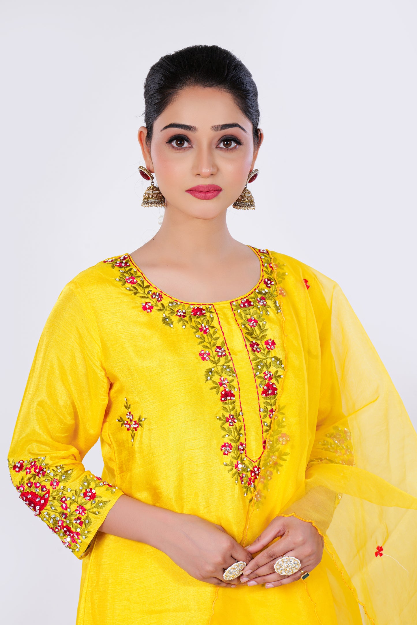 Straight Kurta Set with Organza Dupatta is made from luxurious Dola Silk and Hand Embroidery in Yellow Colour