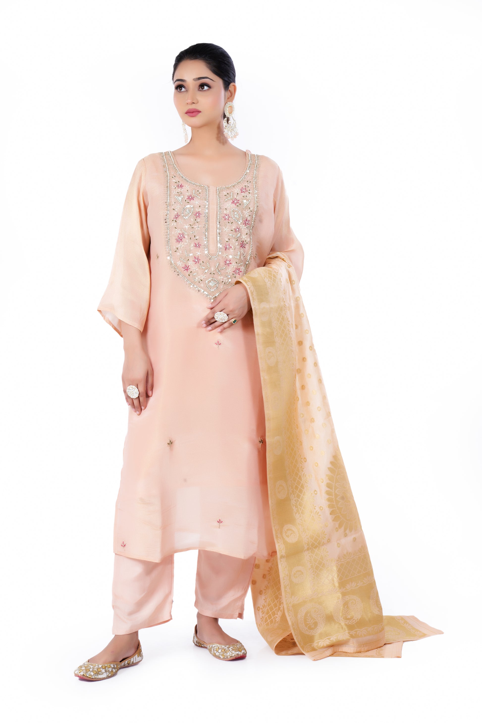 Straight Kurta Set with Banarasi Dupatta is made from luxurious Tissue and Zardozi Embroidery in Peach Colour