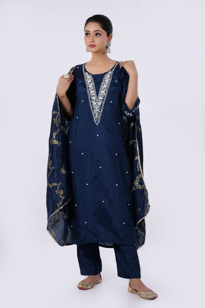 Straight Kurta Set with Banarasi Dupatta is made from luxurious Dola Silk and Mirror & Cut Dana Embroidery in Blue Colour